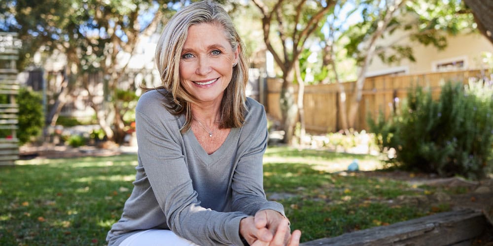 woman happy after preventing breast implant illness in Bloomfield Township, MI