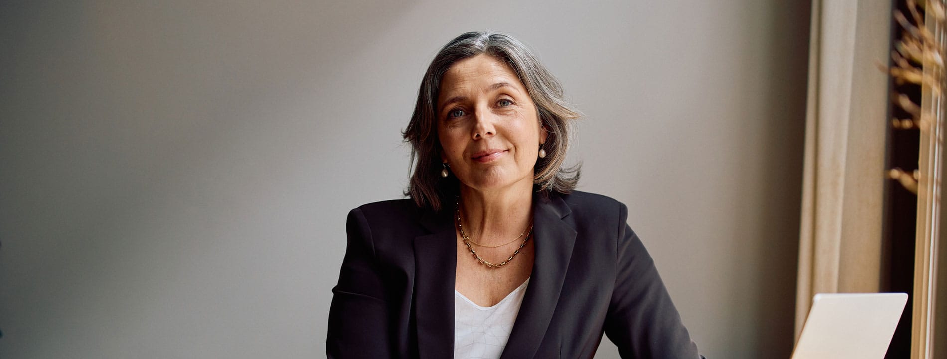 older woman working after breast implant removal in Bloomfield Township, IL