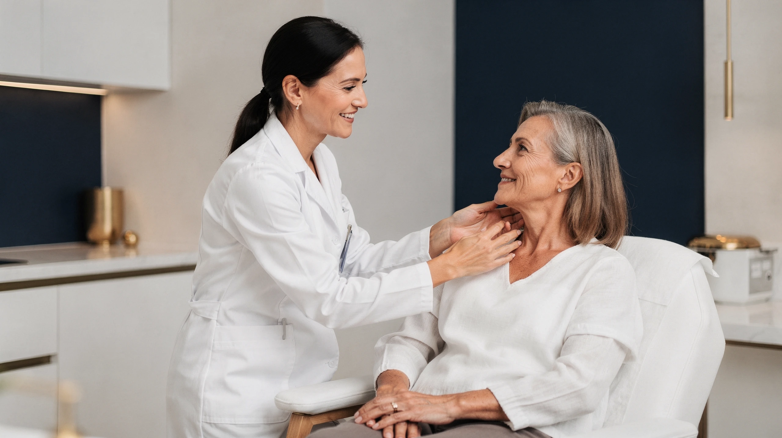 Clinician in white coat examining a patient's chest and neck in a modern medical office