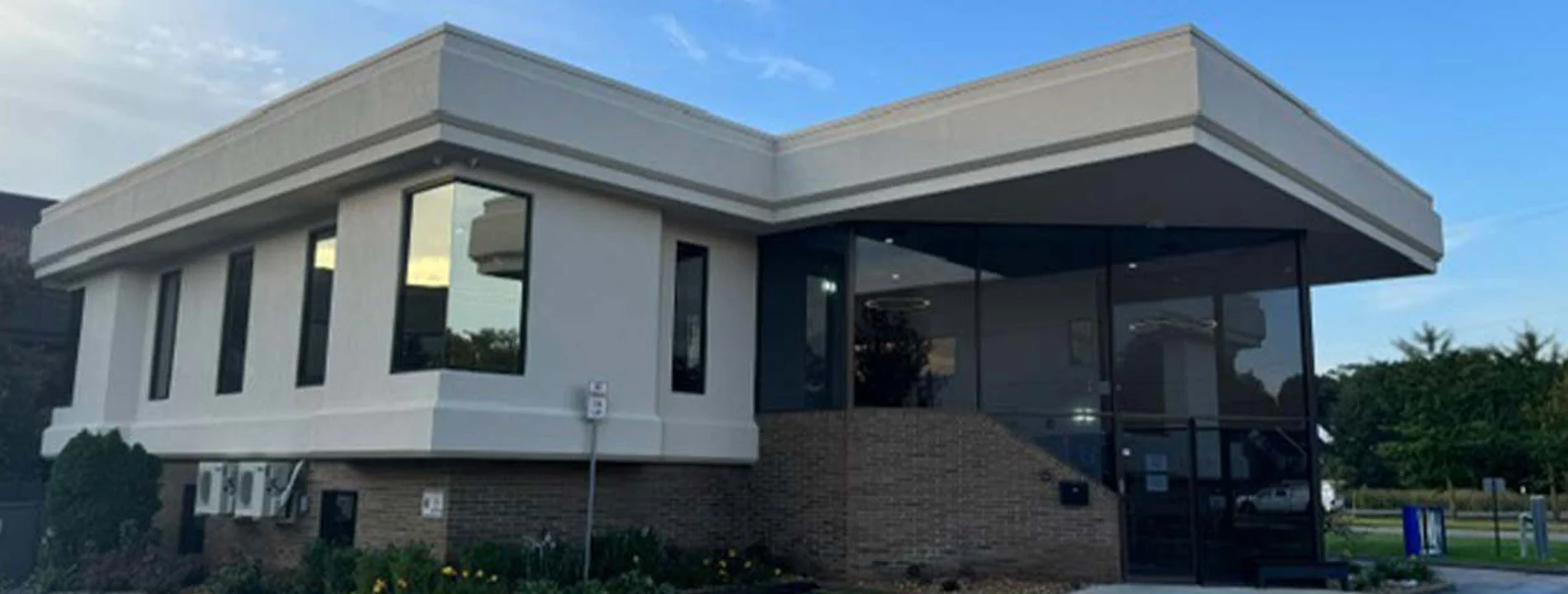 Modern medical office building exterior with brick and glass facade