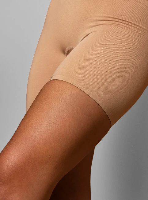 Close-up of woman's thigh and hip area showing skin texture and contour