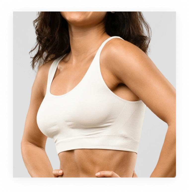 Woman wearing white sports bra showing torso and abdominal definition